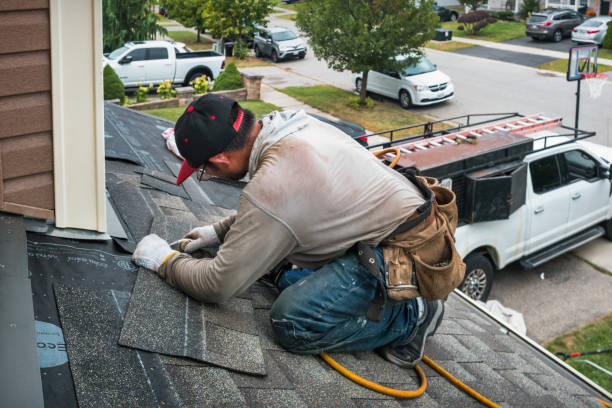 Professional Roof Replacement technician working in Russells Point, OH